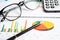 Eyeglass with calculator on chart graph paper. Finance, account, statistic, investment data economy, stock exchange business