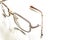 Eyeglasses with a broken handle on a bright background