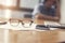 eyeglasses, business document and laptop computer notebook on wooden table