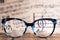 Eyeglasses Glasses with Bifocals and Black blue Frame smudged agaist musical note sheet.  Blurry Vision Concept