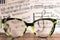 Eyeglasses Glasses with Bifocals and Black blue Frame smudged agaist musical note sheet.  Blurry Vision Concept