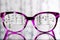 Eyeglasses Glasses with Bifocals and Black pink Frame smudged agaist birch trees