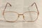 Eyeglasses lying on an old book