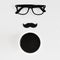 Eyeglasses, moustache and cup of coffee