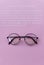 Eyeglasses with pink paper with message