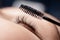Eyelash extension procedure with comb. Black fake long lashes beautiful woman eyes
