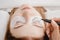 Eyelash extension procedure. Master marker puts markup scheme guide lashes