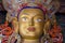 Eyes of Maitreya Buddha face close up. Thiksey Gompa. Ladakh, India