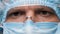 Eyes of onfident Doctor or Healthcare Worker in Personal Protective Kit Preparing for Surgery. Doctor Wearing Safety