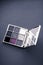 Eyeshadow palette and make-up brush on graphite background, eye shadows cosmetics product for luxury beauty brand promotion and