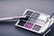 Eyeshadow palette and make-up brush on graphite background, eye shadows cosmetics product for luxury beauty brand promotion and