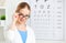 Eyesight check. woman in glasses at doctor ophthalmologist optic