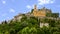 Eze village with it`s prominent ochre colored church and clocktower, France.