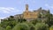 Eze village with it`s prominent ochre colored church and clocktower, France.