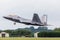 F-22A Raptor lifts it`s landing gear as it exits the runway