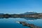 Faakersee - A panoramic view on the Faaker lake in Austrian Alps. The lake is surrounded by high mountains.