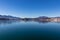 Faakersee - A panoramic view on the Faaker lake in Austrian Alps. The lake is surrounded by high mountains. Calm surface