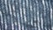 Fabric background with metallic weave.  Coarse woven gray material with shiny inserts.  Texture of rough curtain fabric with inter