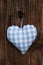 Fabric blue and white checked heart in bavarian style hanging on