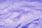 Fabric in Color of the Year 2022, Very Peri. Highly detailed closeup of crumpled violet textile. Abstract background.