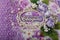 Fabric covered weddig scrapbook album with purple lace, flowers and inscription in Russian reads - Our Wedding.