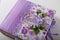 Fabric covered weddig scrapbook album with purple lace, flowers and inscription in Russian reads Our Wedding