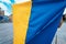 Fabric curved flag of Ukraine. Close up shot, background