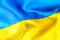 Fabric curved flag of Ukraine, UA. Blue and yellow colors.Ukrainian passport.Stop war.Patriotism.Concept of Ukraine.Democracy and