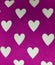 fabric with design of figures of hearts, textured background