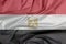 Fabric flag of Egypt. Crease of Egyptian flag background.