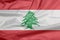 Fabric flag of Lebanon. Crease of Lebanese flag background.