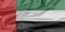 Fabric flag of United Arab Emirates. Crease of UAE flag background.