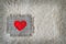 Fabric heart attached on canvas with safety pin