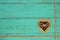 Fabric hearts with rope border on teal blue wooden background