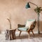 Fabric lounge chair and wood stump side table against beige stucco wall with copy space. Rustic minimalist home interior design of