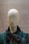 Fabric mannequin, bald linen head . Rag mannequin in a shop window of a fashionable store