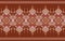 Fabric pattern features a vibrant ethnic design on a warm brown background. Bold geometric shapes, including triangles, diamonds,