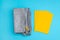 Fabric pencil cases and yellow envelope on blue background