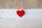 Fabric red heart on white wood with space on hessian and canvas texture background