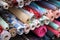 Fabric rolls and colorful textiles on market stand