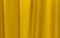Fabric yellow curtains. Abstract background, curtain, drapes gold fabric. Crumpled cloth, folds of fabric