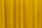 Fabric yellow curtains. Abstract background, curtain, drapes gold fabric. Crumpled cloth, folds of fabric