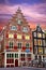 Fabulous ancient medieval houses with shutters at dusk and bikes