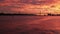 Fabulous bloody sunset over Tagus river fron a boat Lisbon