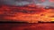 Fabulous bloody sunset over Tagus river over 25th April Bridge Lisbon