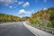 Fabulous highway with scenic autumn maple trees along the road in Vermont