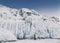 Fabulous ice icicles on the rocks of lake Baikal. Tourist photographs the icy rocks. Eastern Siberia