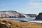 A fabulous landscape on the shore of the majestic frozen Lake Baikal in winter and the island of Olkhon.