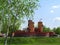 Fabulous medieval brick castle with three towers in the park `Kazka` in Sumy