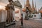 Fabulous, mystical, Buddhist Asian temple. The woman is impressed by the beauty of the statues. The girl looks at the